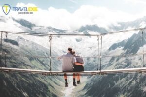AI-generated image of a romantic couple sitting on a hanging bridge overlooking snow-covered Swiss mountains during their luxury honeymoon in Switzerland.