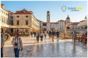 Pleasant summer day in Europe with historic streets and travellers exploring.